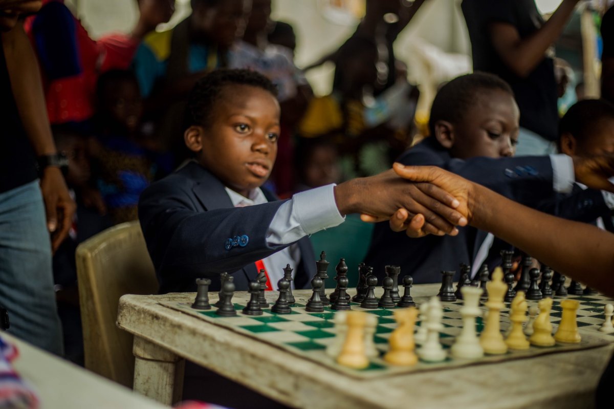Ferdinand shaking hands over a chess game